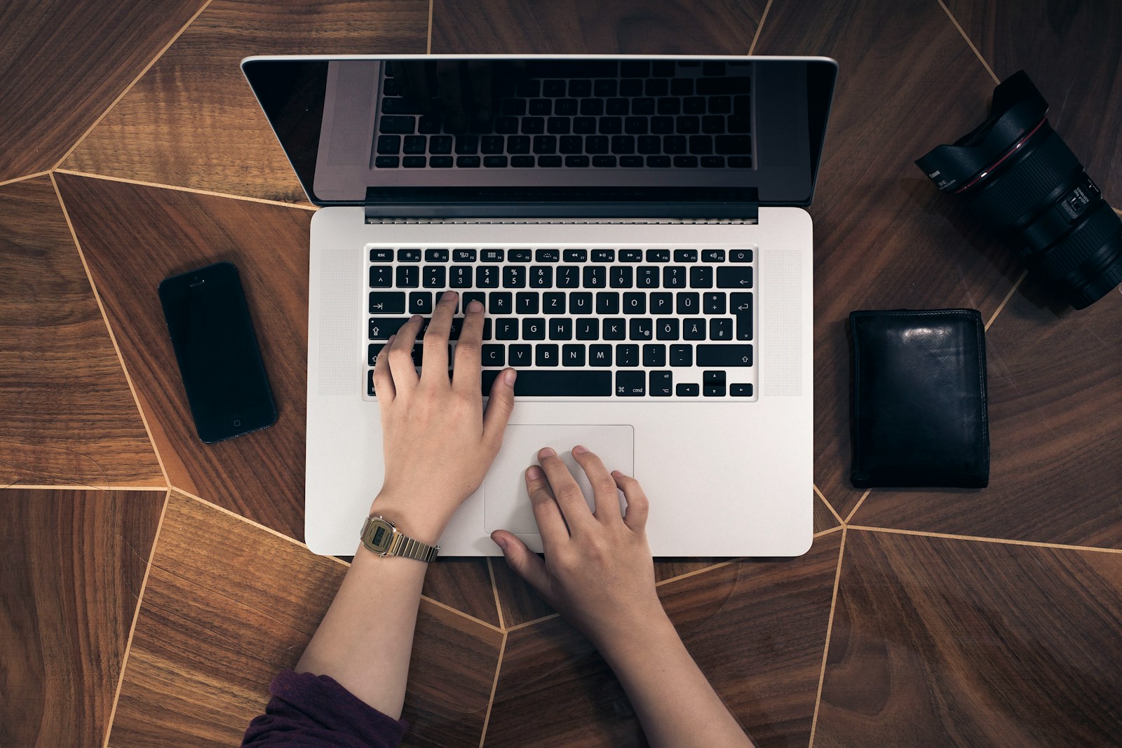 person using MacBook Pro, Cybersecurity